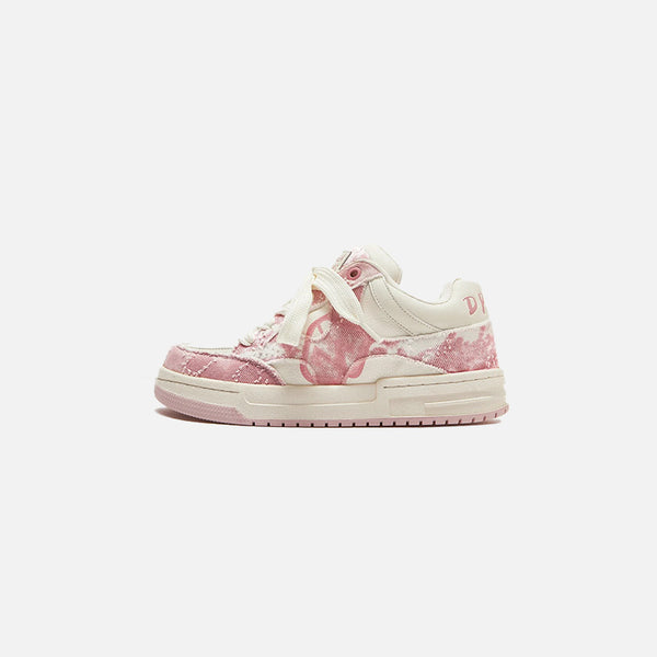 Side view of the pink Turtle Power Sneakers in a gray background