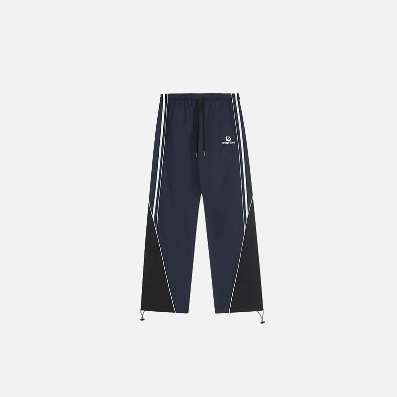 Front view of the navy Y2K Loose Patchwork Cargo Pants in a gray background