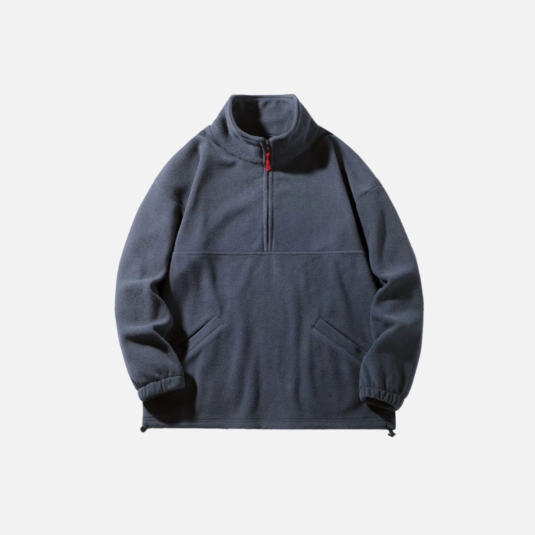 Front view of the navy blue Half-Zip Fleece Jacket in a gray background