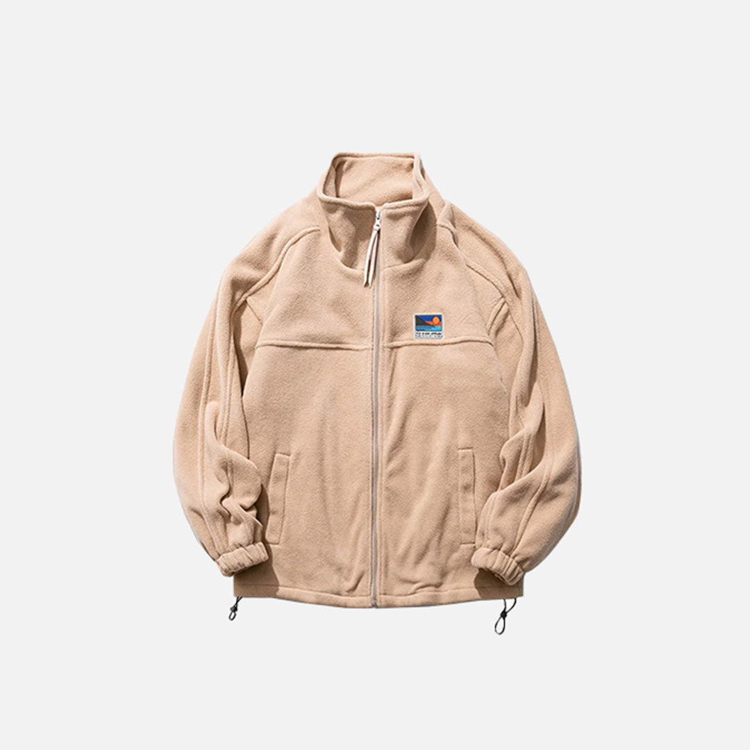 Front view of the khaki Adventure Seeker Jacket in a gray background