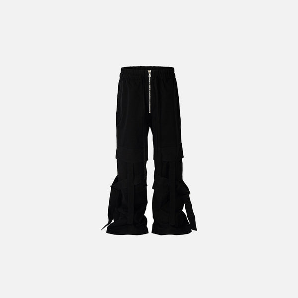 Front view of the Edgy Black Flare Baggy Pants in a gray background