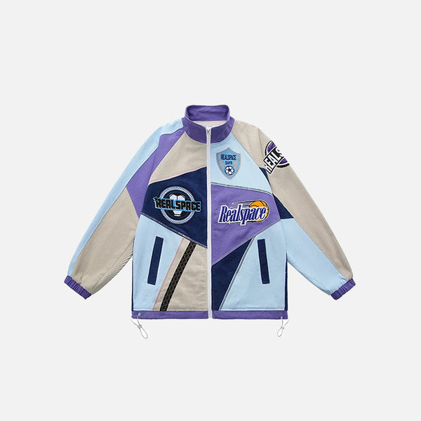 Front view of the blue Patchwork Varsity Racing Jacket in a gray background