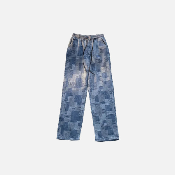 Front view of the blue Patchwork Textured Jeans in a gray background