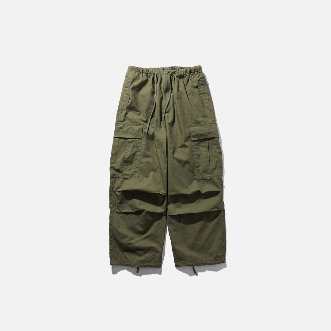 Front view of the green Adventure-Ready Cargo Pants in a gray background 