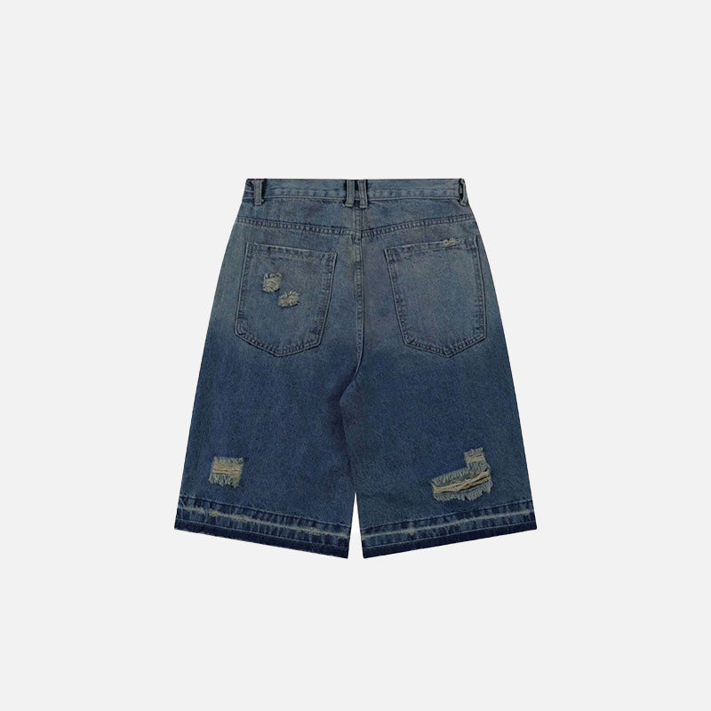 Back view of the blue Y2k Ripped Washed Jorts in a gray background