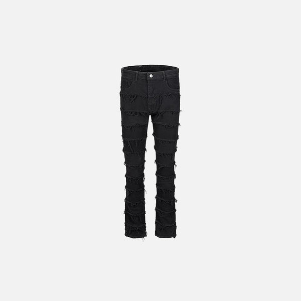 Front view of the black Distressed Patchwork Skinny Jeans in a gray background