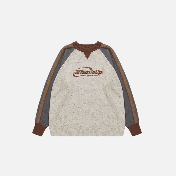 Front view of the white sand Vintage Stitching Color Dot Sweater in a gray background 