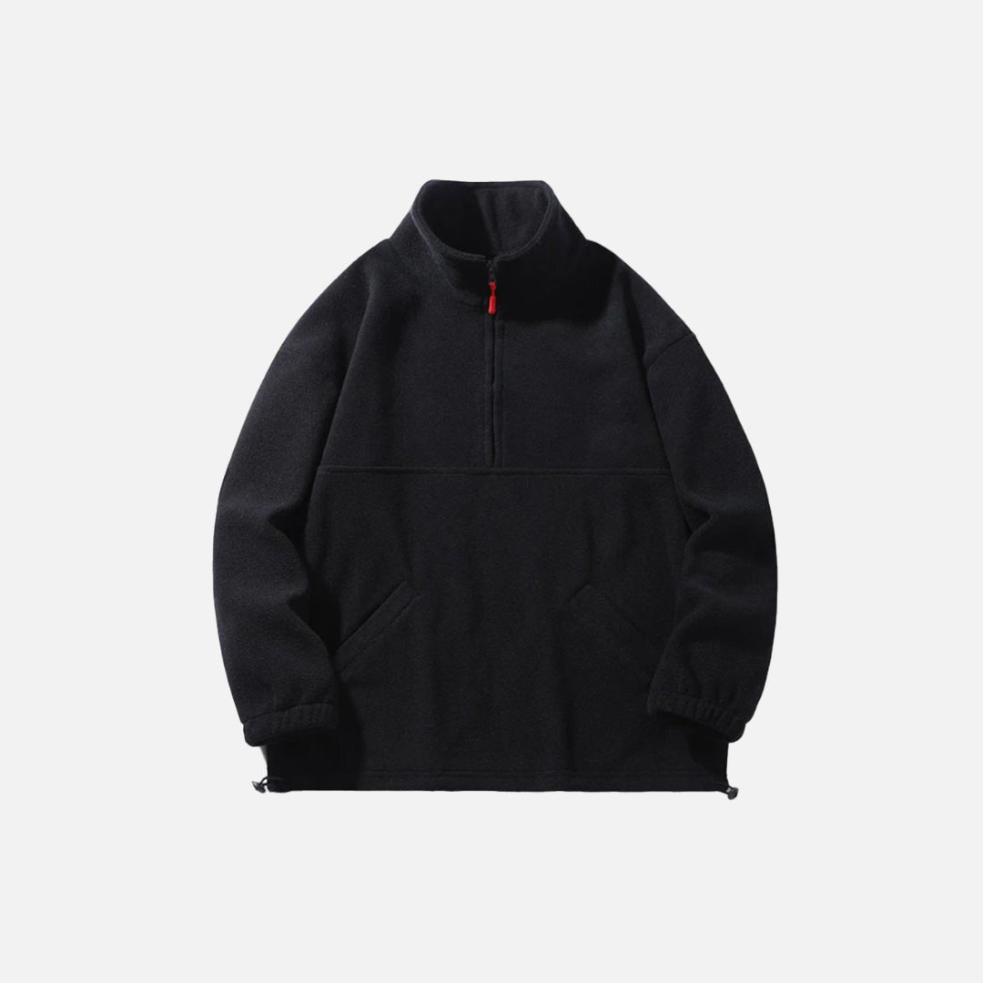 Front view of the black Half-Zip Fleece Jacket in a gray background