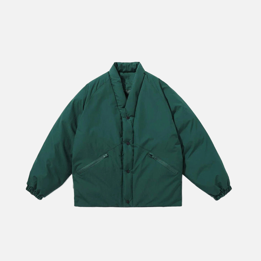 Front view of the green Minimalost Boxy Jacket in a gray background