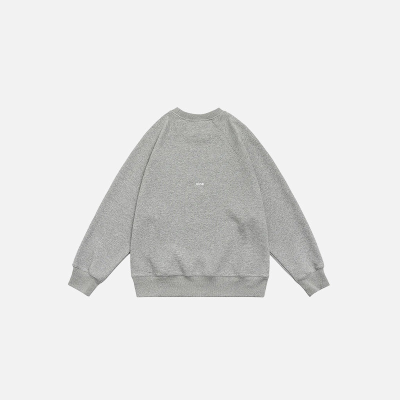 Back view of the grey beige Number 9 Embroidered Sweatshirt in a gray background