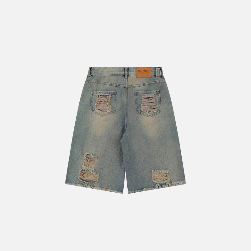 Back view of the blue Washed Distressed Jorts in a gray background 