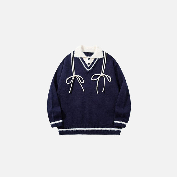 Front view of the navy blue Vintage Drawstring Oversized Sweater in a gray background