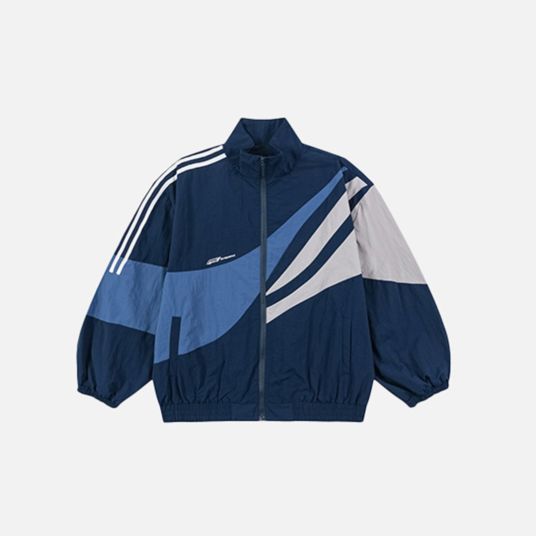 Front view of the blue Velocity Windbreaker Jacket in a gray background