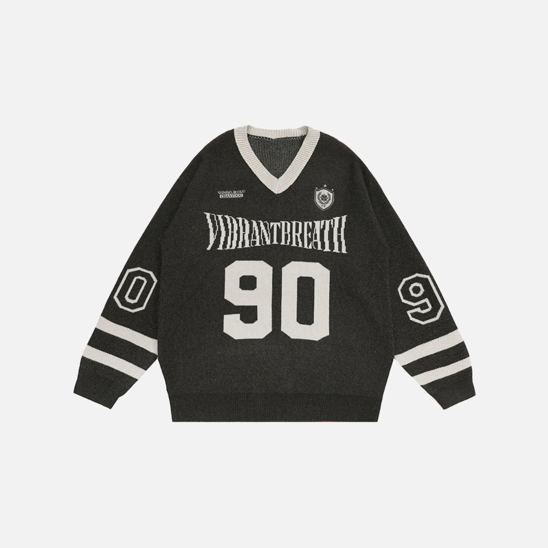 Front view of the gray Y2K Victory Varsity Sweater in a gray background