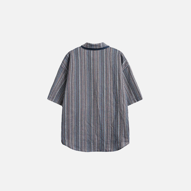 Back view of the navy blue Women's Oversized Striped Shirt in a gray background