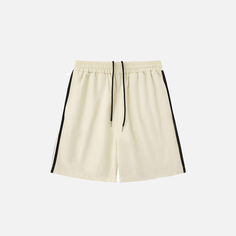 Front view of the beige Side Striped Sports Shorts in a gray background 