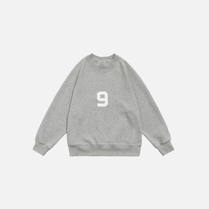 Front view of the grey Number 9 Embroidered Sweatshirt in a gray background