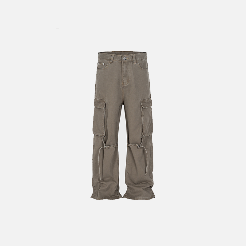 Front view of the brown Loose Washed Pleated Jeans in a gray background