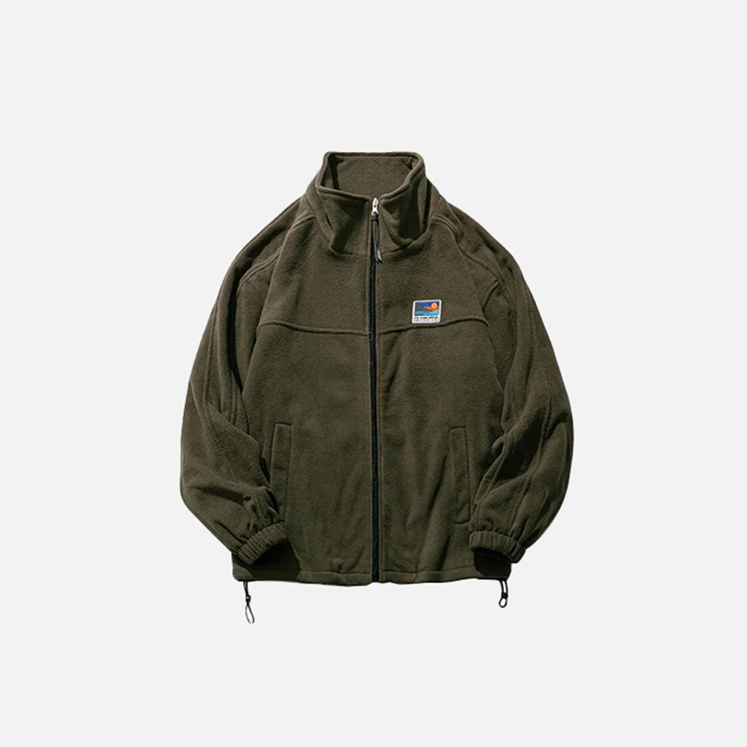 Front view of the army green Adventure Seeker Jacket in a gray background