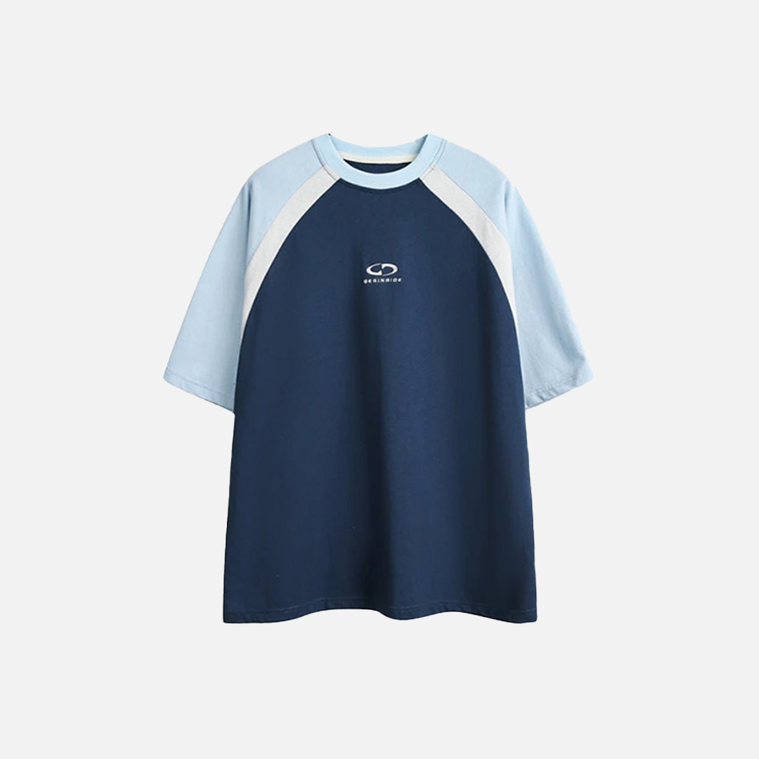 Front view of the blue Classic Raglan T-shirt in a gray background