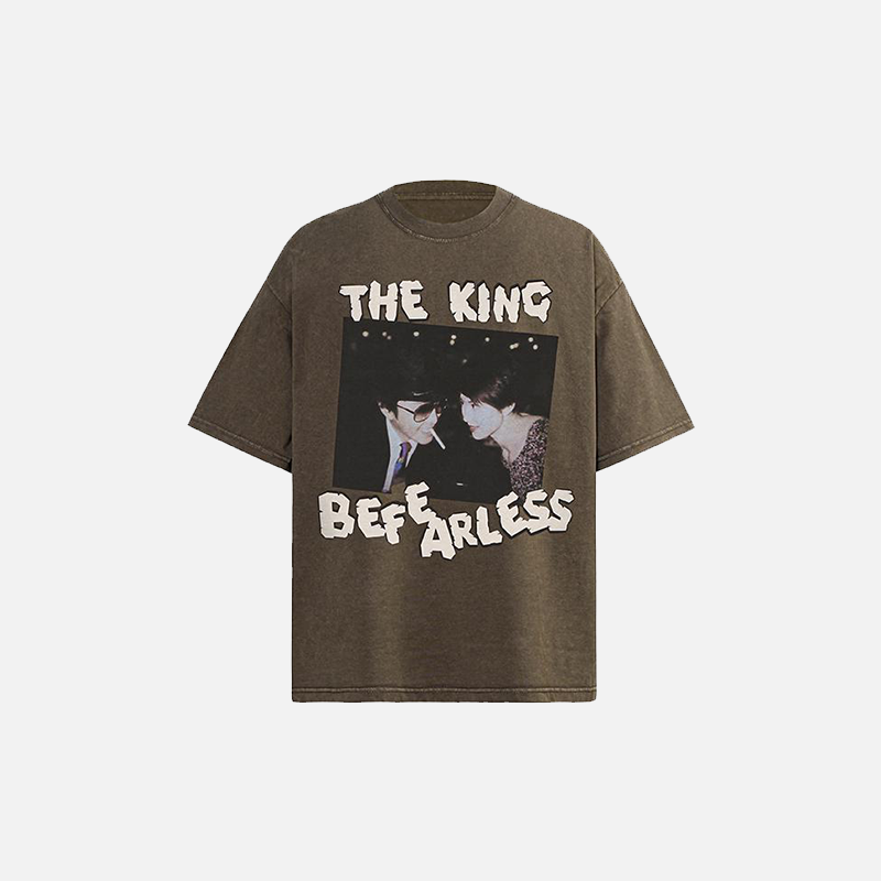 Front view of the brown The King Be Fearless Graphic T-shirt in a gray background