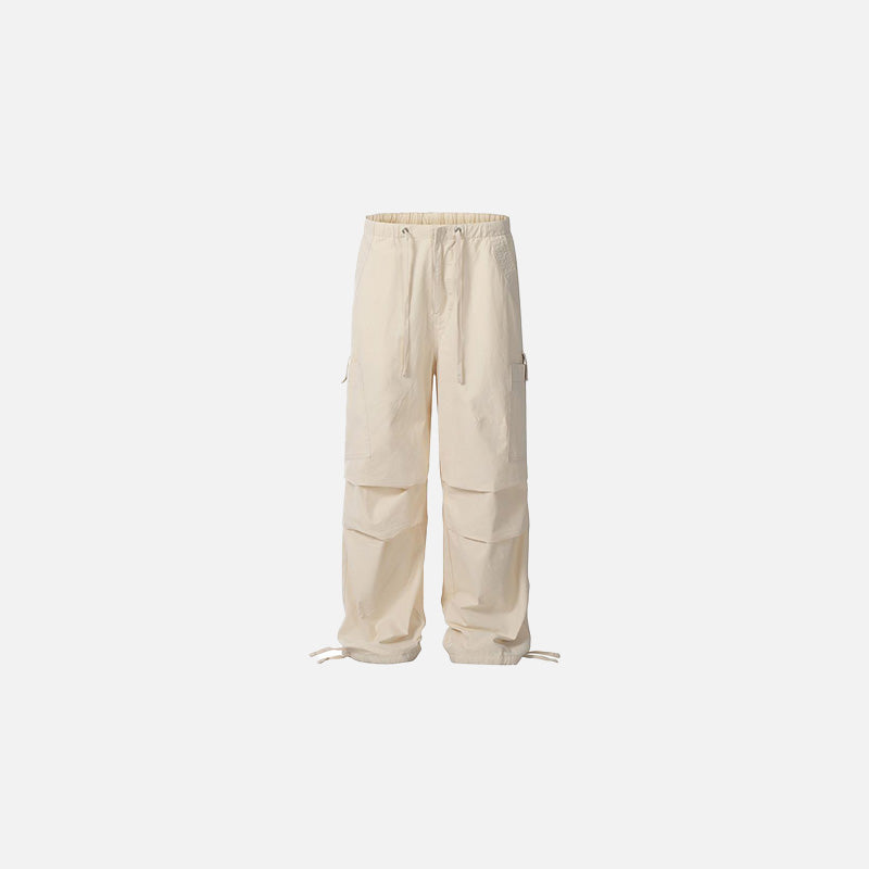 Front view of the apricot Utility Cargo Pants in a gray background