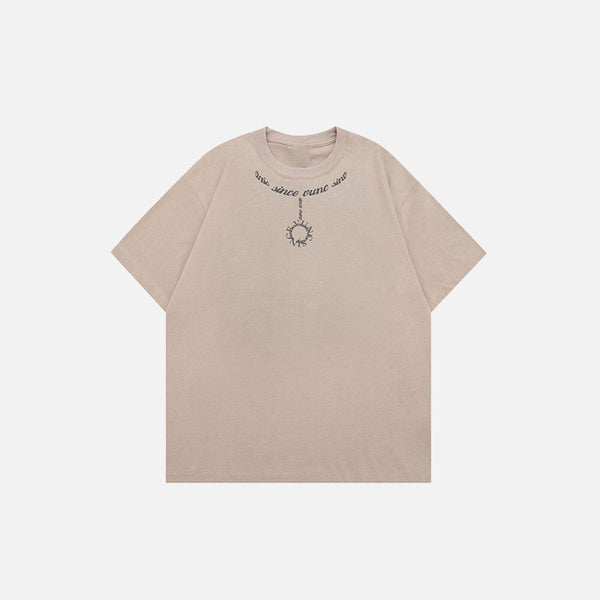 Front view of the camel Loose Chain Printed T-shirt in a gray background 