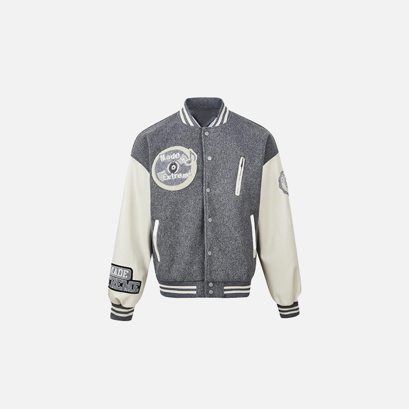 Front view of the gray Extreme Varsity Jacket in a gray background