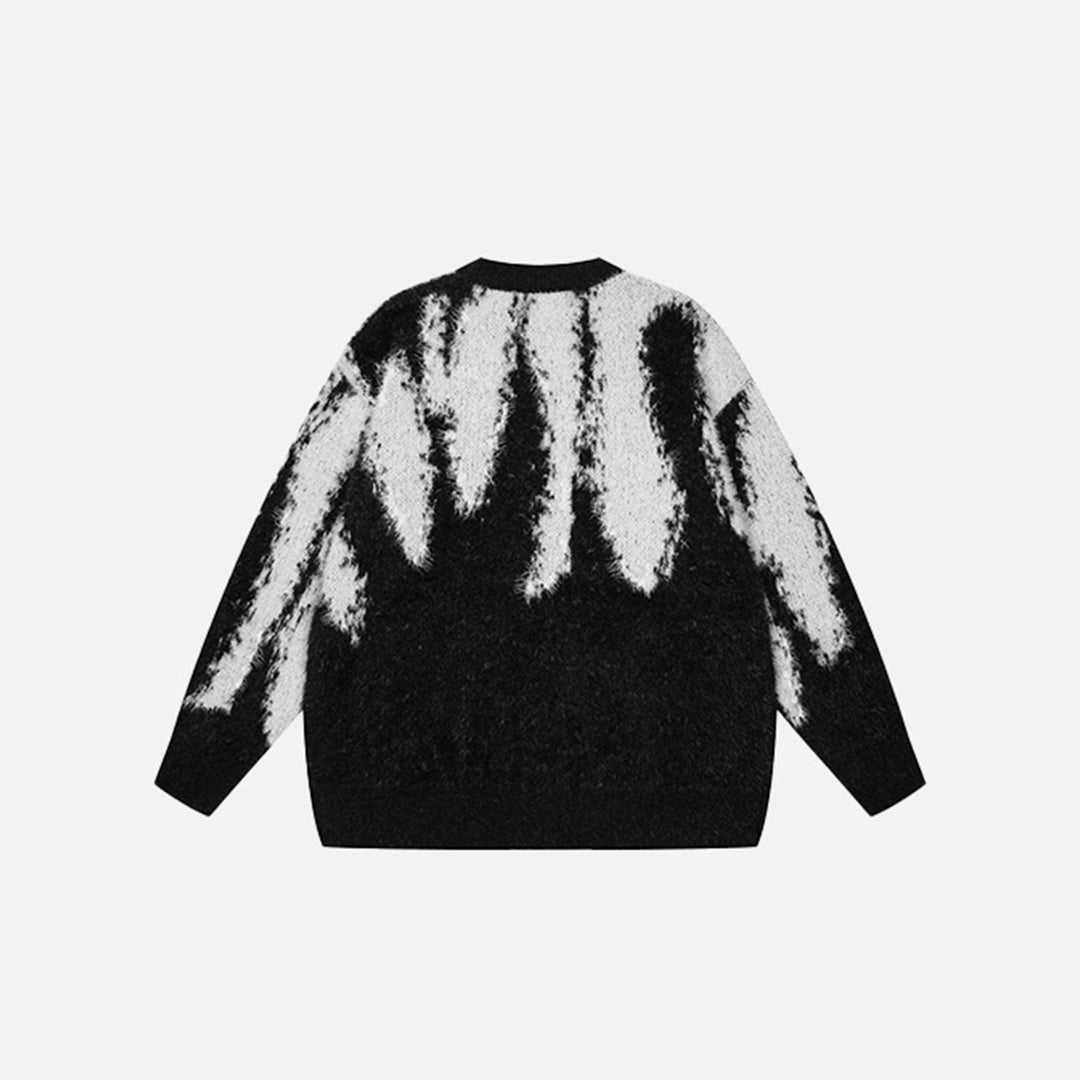 Back view of the black Tie Dye Knitted Sweater in a gray background