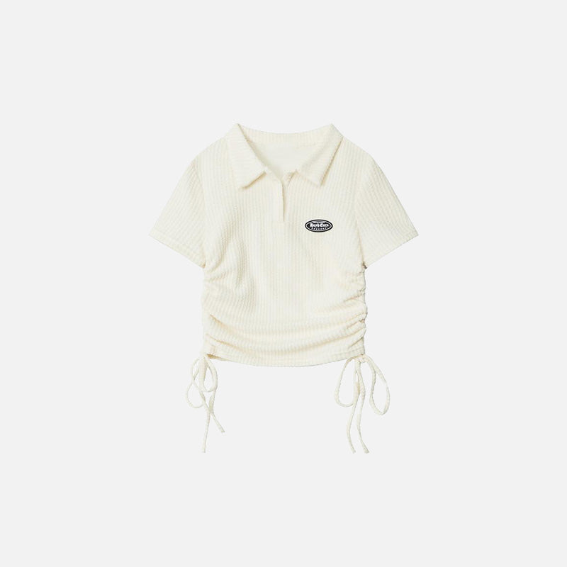 Front view of the apricot Women's Polo With Side Ties T-shirt  in a gray background 