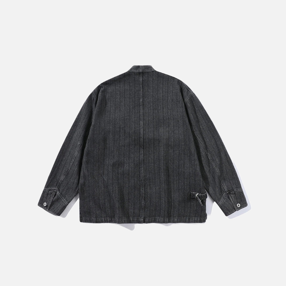 Back view of the black Relaxed Utility Wrap Jacket in a gray background