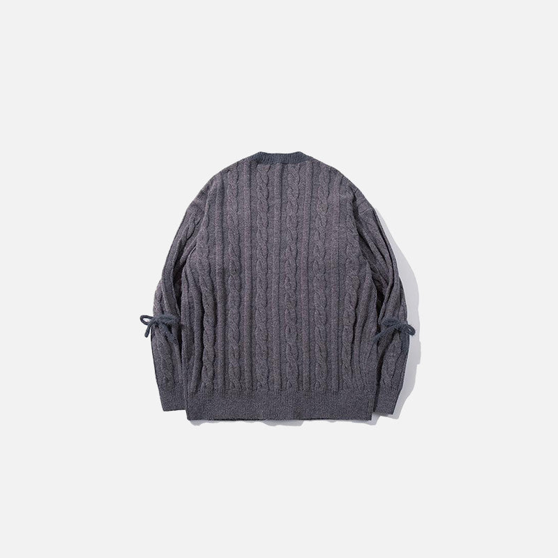 Back view of the grey Chunky Textured Knit Sweater in a gray background