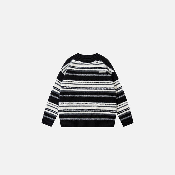 Front view of the black Striped Loose Sweater in a gray background