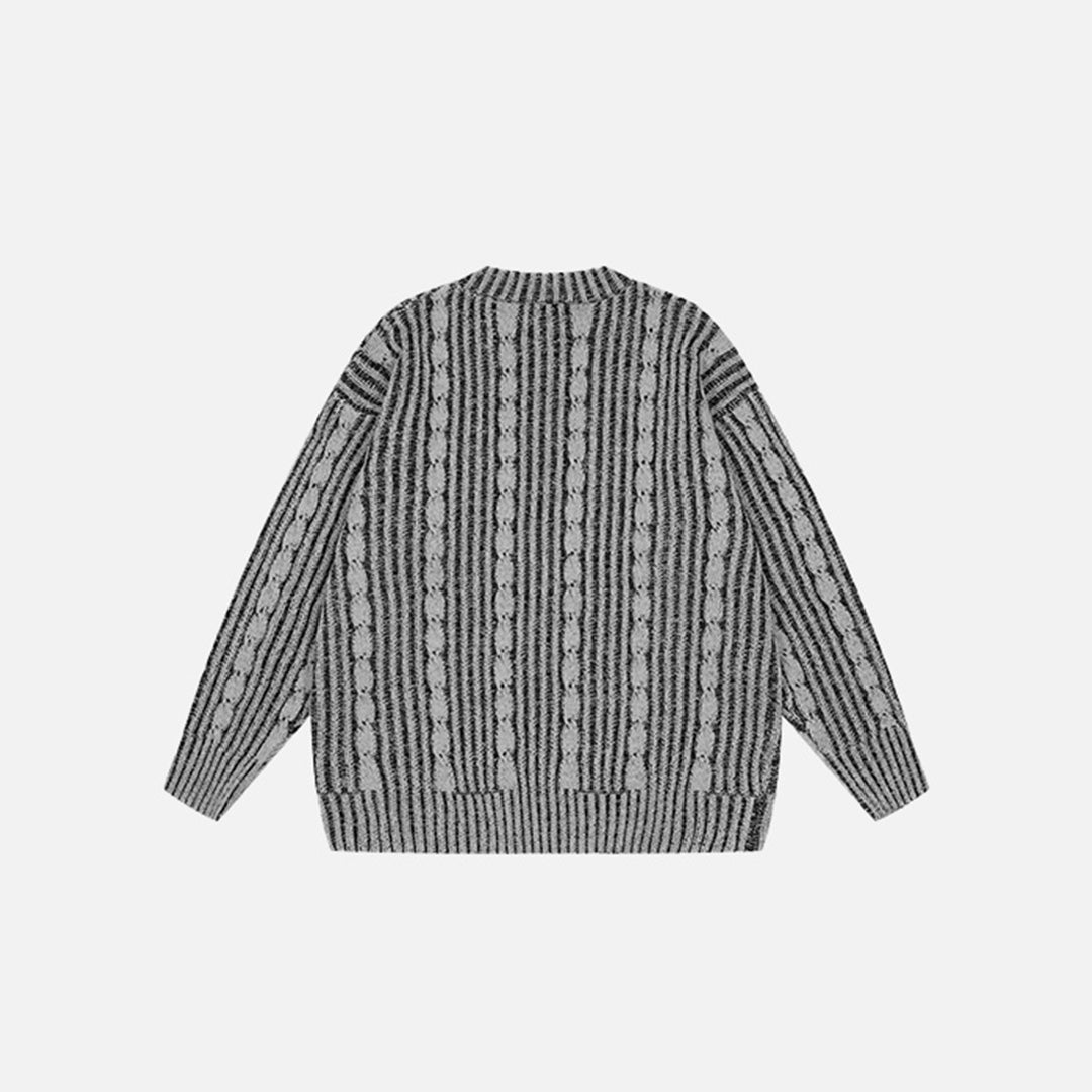 Back view of the black Vintage Stripes Loose Sweater in a gray background