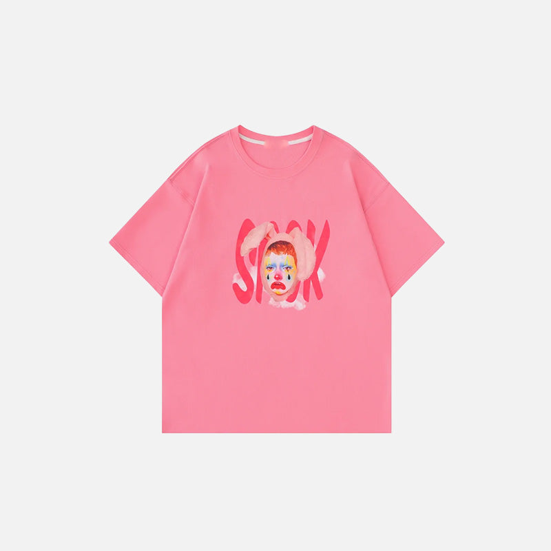 Front view of the pink Artistic Face Print Oversized T-shirt in a gray background