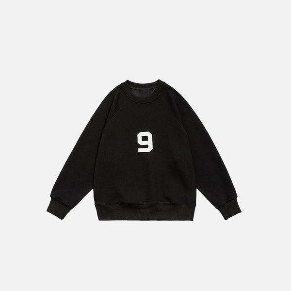 Front view of the black Number 9 Embroidered Sweatshirt in a gray background