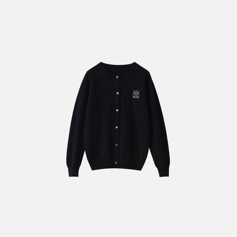 Front view of the black Timeless Button-Up Sweater in a gray background