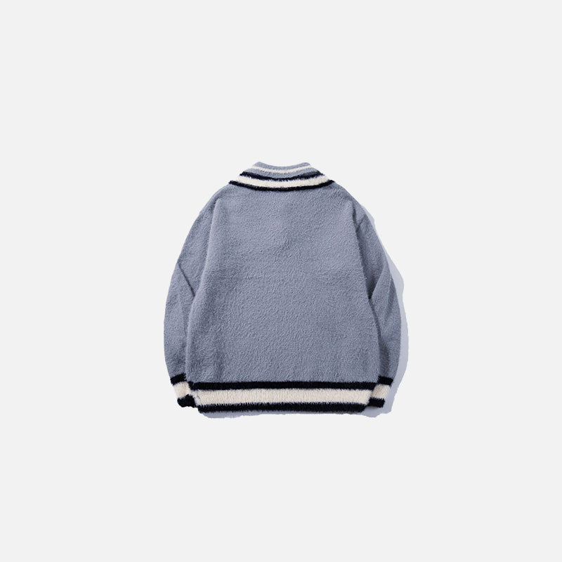 Back view of the blue Preppy Tie Sweater in a gray background