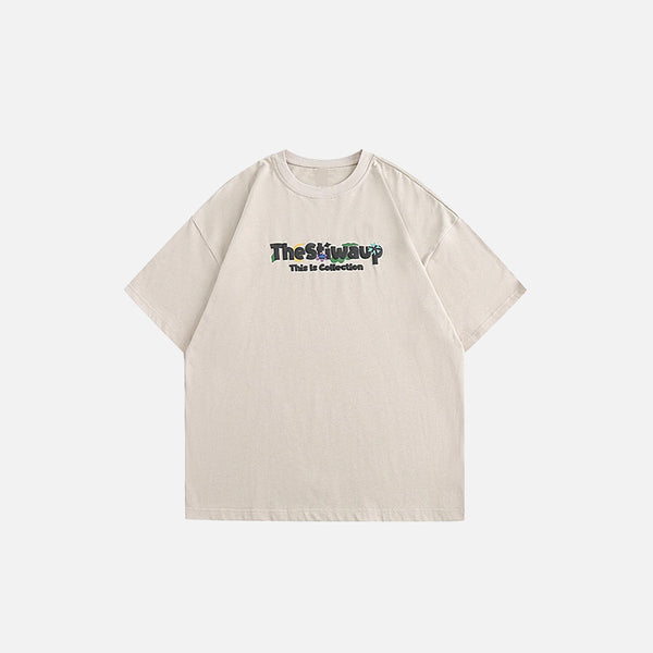 Front view of the khaki TheStwaup Graphic T-shirt in a gray background