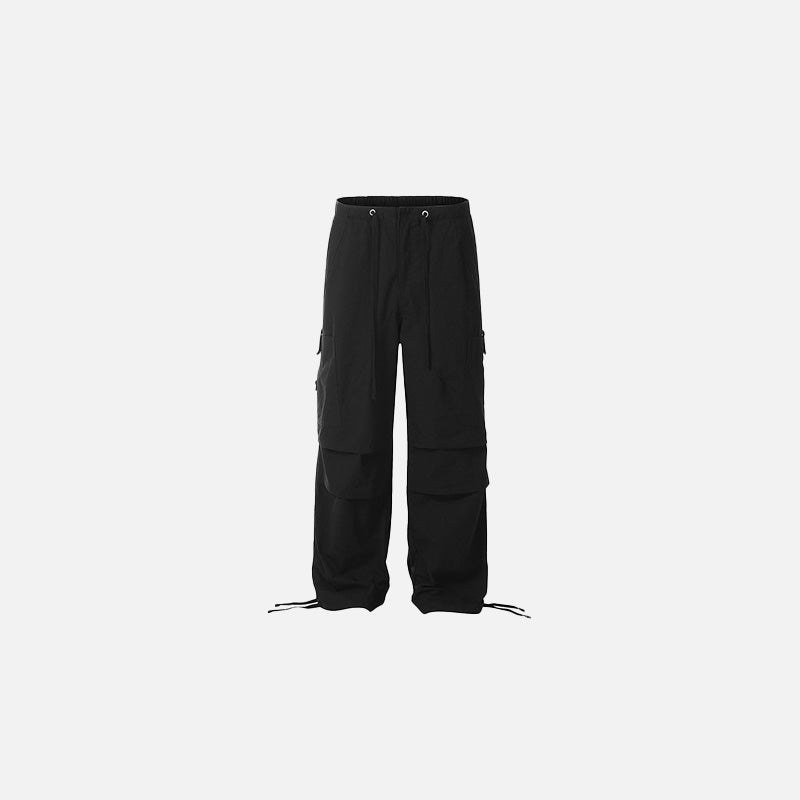 Front view of the black Utility Cargo Pants in a gray background