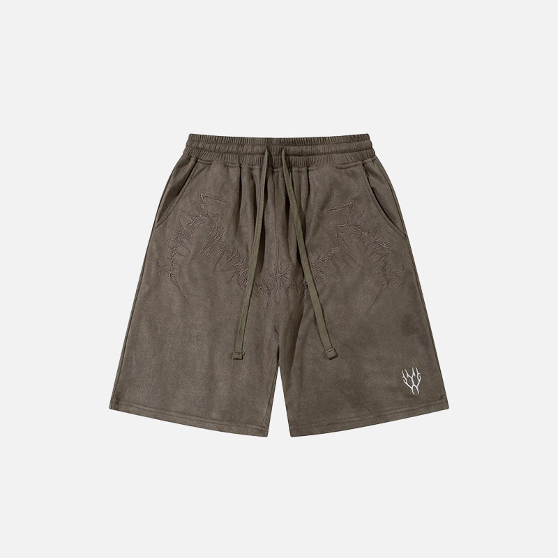 Front view of the brown Y2K Embroidery Baggy Shorts in a gray background