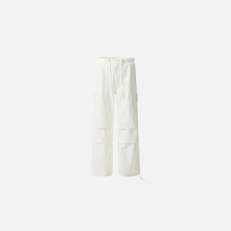 Front view of the white Utility Cargo Pants in a gray background