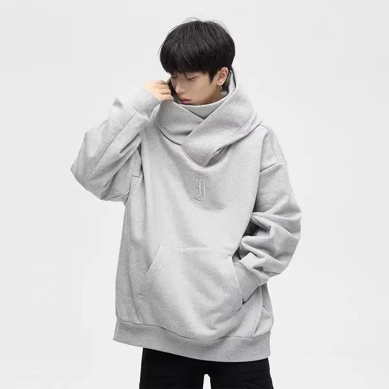 Model wearing the gray Oversized Cowl Hoodie in a gray background