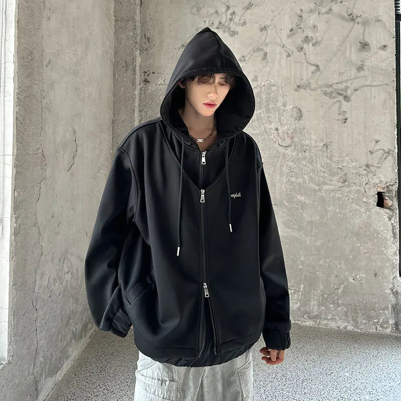 Model wearing the black Zenith Zip-Up Hoodie