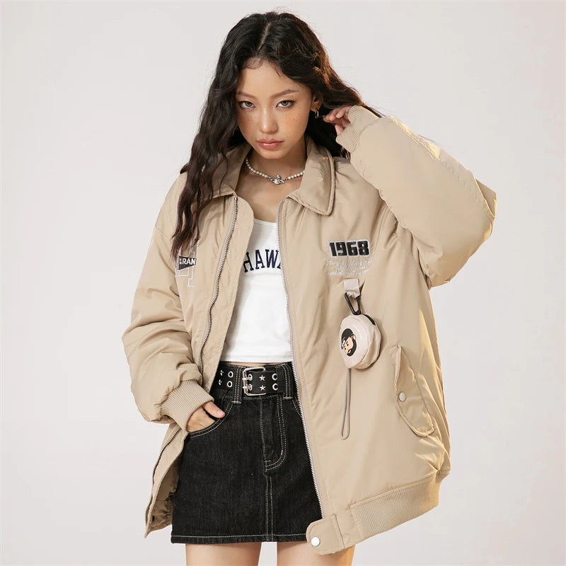 Model wearing the khaki Vintage 1968 Utility Jacket in a gray background