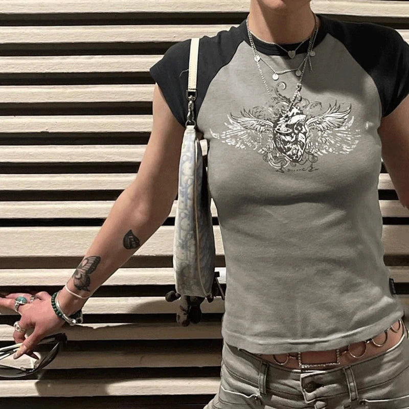 Model wearing the gray Winged Skull Emblem Graphic T-shirt 