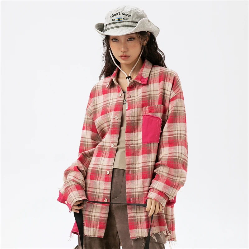 Model wearing the red Plaid Reversible Long Sleeve Shirt in a gray background 