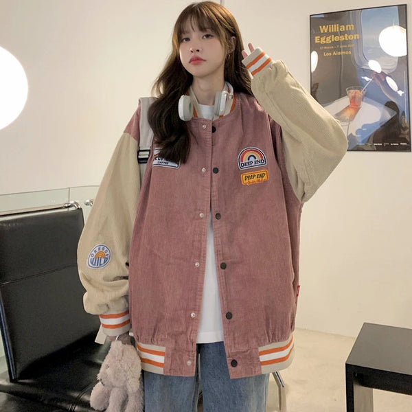 Model wearing the pink Vintage Embroidery Loose Varsity Jacket