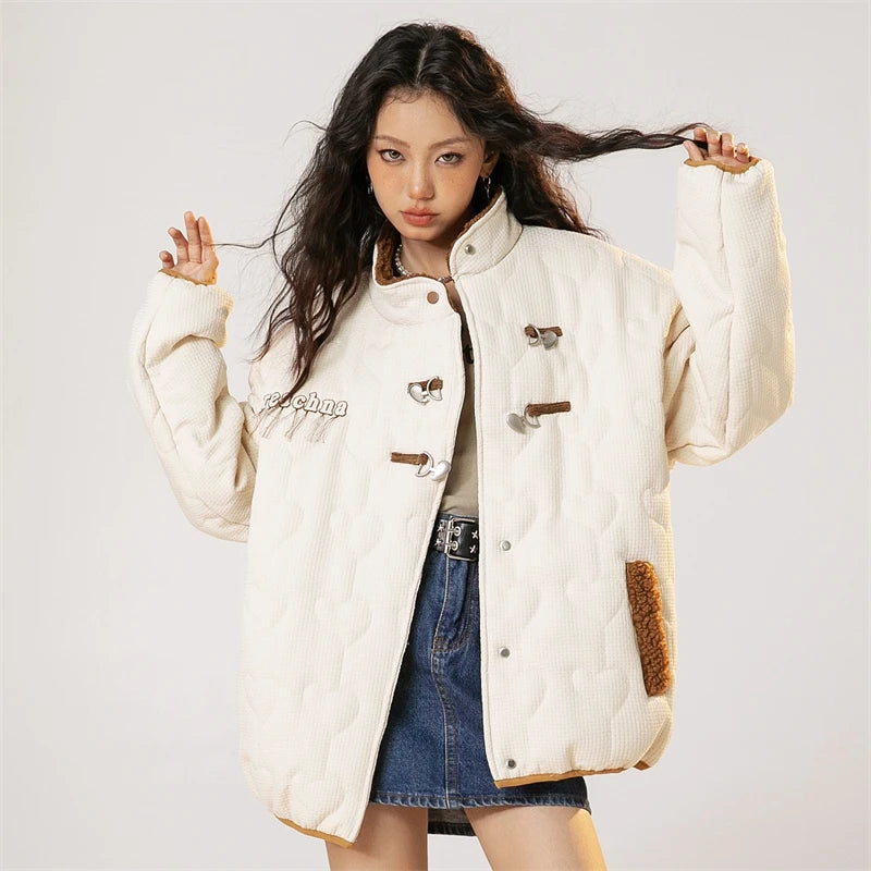 Model wearing the white Vintage Breeze Puffer Jacket in a gray background