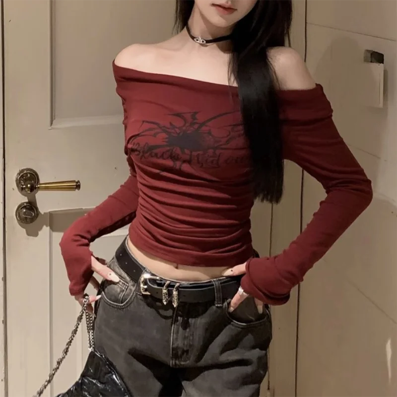 Model wearing the red Off-Shoulder Spider Graphic Crop Top